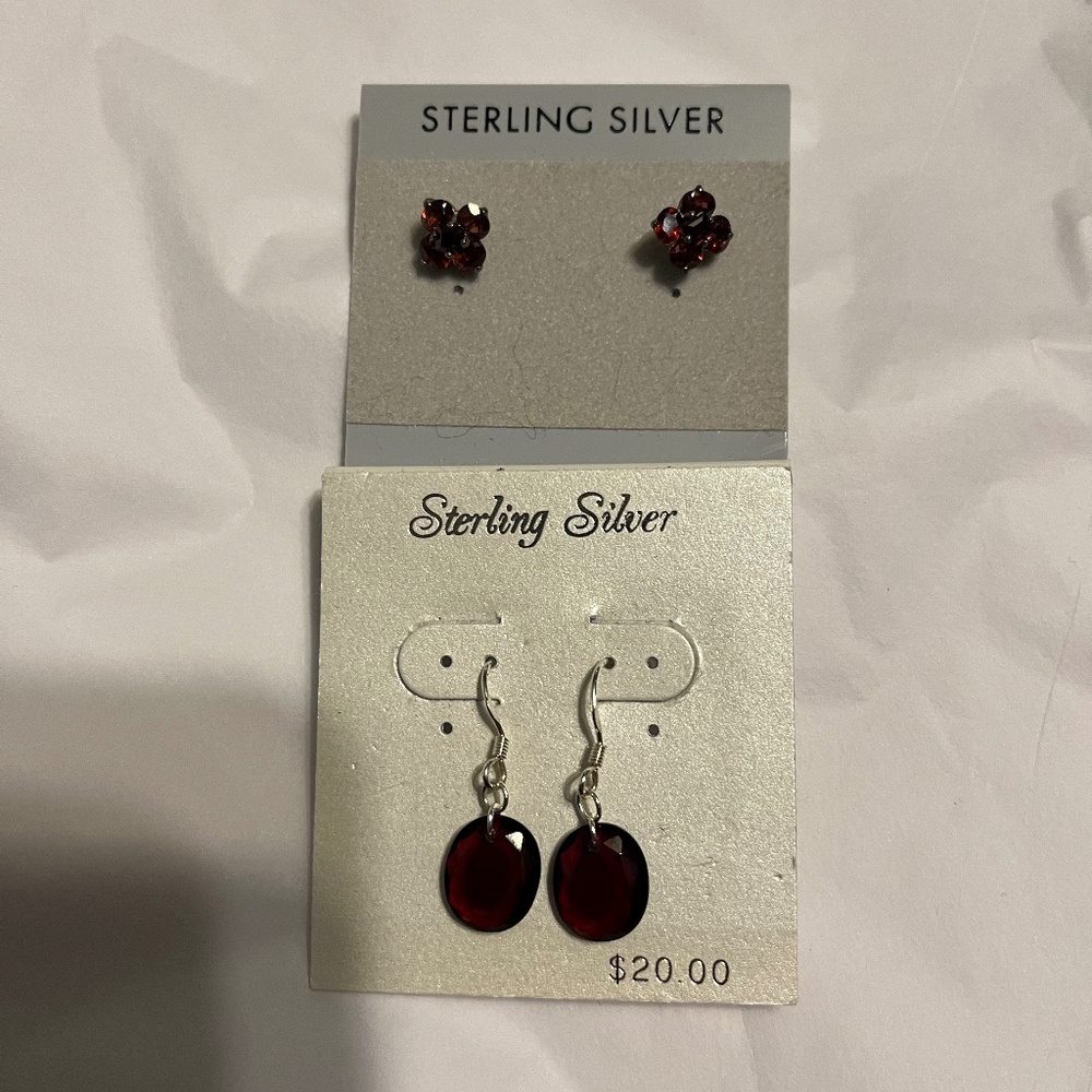 Sterling silver with red stone earrings. 2 pair. New.